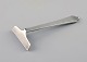 Georg Jensen 
Pyramid child's 
pusher in 
sterling 
silver. Dated 
1933-44.
Length: 8.5 
cm.
In ...