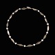 Th. 
Skat-Rørdam.  
Halskæde i 14k 
Guld med 
perler.
Tegnet og 
udført hos Th. 
Skat-Rørdam - 
...