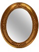 Ovalt spejl med 
ramme af 
bladguld, fra 
1920erne. 
Spejlet er i 
flot antik 
stand. 
H - 53.5 cm, B 
...