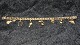 #Bismarck 
Armbånd Med 
#Charms 14 
karat Guld
Stemplet 585 
AAA 1974-1987 
Aage Albing A/S
Længde ...