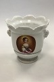 Flowerpot Cover 
of white 
porcelain 
decorated with 
Ram heads and 
women 
portraits. 
Measures 19 cm 
...