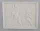 Bing and 
Grøndahl after 
Thorvaldsen. 
Antique biscuit 
wall plaque 
with putis and 
swan in relief. 
...