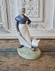 Royal 
Copenhagen 
Figur, Gåsepige 

No. 528, 1. 
sortering
Højde 18,5 cm.
Design: 
Christian 
Thomsen
