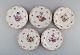 Fem antikke 
Meissen 
porcelænstallerkener 
med håndmalede 
blomster og 
gulddekoration. 
Sent ...