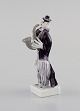 Peter Strang 
(f.1936) for 
Meissen. Figur 
i håndmalet 
porcelæn. 
Saxofonist fra 
klovneorkestret.
 ...