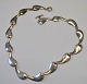 Sterling 
necklace, 20th 
century 
Denmark. 15 
link. Stamped. 
Length: 42 cm.