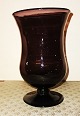 Amethyst Purple 
coloured 
drinking glass 
on foot from 
the 19th 
century. 
Unknown origin. 
Several ...