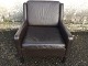 Armchair in 
brown leather 
with dark 
stained legs. 
Danish modern. 
The chair has 
patination / 
...