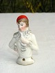 Tysk porcelæns 
halvdukke, til 
montering på 
nålepude. 
Vinter klædt 
kvinde. Nr 
3852. Højde 4,8 
cm. ...