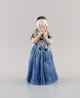 Royal Copenhagen porcelain figurine. Girl from Bornholm. Model number 1323.
