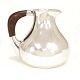 Hans Hansen sterlingsilver pitcher. Designed 1930. Signed and dated 1953. 
Guaiacium handle. H: 14cm. W: 551gr