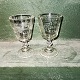 Par pressede glas fra omkring 1900. Dekoreret med slibninger af druer samt grene og bladværk. ...