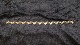 Elegant armbånd i 14 karat GuldStemplet  585Længde 19 cmBrede 9,91 mmTykkelse 2,70 ...