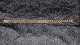 Elegant armbånd i 14 karat GuldStemplet AAE 585Længde 19,5 cmBrede 8,45 mmTykkelse 3,37 ...