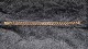 Elegant 
bracelet in 14 
carat Gold
Stamped AAE 
585
Length 19.5 cm
Width 8.45 mm
Thickness ...