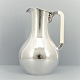A Danish 
pitcher in 
hallmarked 
silver. H. 17,5 
cm. 
Made in 
Denmark, 1944. 
Please contact 
...