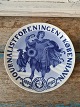 B&G Mindeplatte 
fra 1910 25-års 
jubilæum for 
Københavns 
Journalistforening.

1. ...