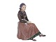 Large Dahl 
Jensen 
figurine, woman 
in "Amager 
Dress".
The factory 
mark tells, 
that this was 
...