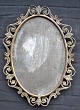 Mirror, 19th 
century. Bronze 
and bronzed 
iron frame.