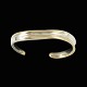 Georg Jensen 
Armring i 18k 
guld og 
sterling sølv 
#406 - Minas 
Spiridis
Tegnet af 
Minas ...