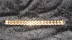 Elegant Armbånd 
18 karat guld
Stemplet  750
Længde 18,5 cm
Brede 16,20 mm
Tykkelse 2,57 
...