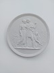 Bertel 
Thorvaldsen: 
Royal 
Copenhagen 
bisquit platte  
"Ungdom og 
forår" Efter 
relief 
modelleret i 
...