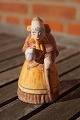 Hjorth Danish ceramics figurine, old wife with 
pitcher and stick in suit