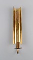 Pierre Forsell for Skultuna. Reflex wall candlestick in brass. Swedish design, 
1960s.
