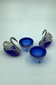 German? Silver 
Salt Cellars in 
blue glas (4) 
Two open  salt 
cellars and two 
moulded as 
Swans ...