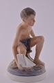 Dahl Jensen, 
porcelæns 
figur. DJ 
figur, dreng 
med sejlbåd nr. 
1245. Højde 
14,5 cm. 1. 
Sortering, ...