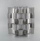 Max Sauze 
(f.1933), 
fransk 
designer. 
Pendel i 
aluminium. 
1980'erne.
Måler: 33 x 32 
cm.
I flot ...