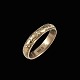 Georg Jensen. 
Ring i 14k guld 
#122 - 62mm
Tegnet af 
Georg Jensen 
1866-1935.
Stemplet med 
...