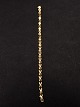 18 karat guld 
armlænke 18 cm. 
B. 0,55 cm. 
vægt 9,4 gr. 
emne nr. 493984
Lager:1