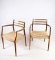 Sæt af 2 armstole, model NO 62, designet af N.O. Møller i teaktræ i 1962. Stolene er fremstillet ...