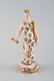 Meissen, 
Tyskland. 
Sjælden 
håndmalet 
porcelænsfigur. 
Dronning med 
krone, nøgle og 
scepter. Sent 
...