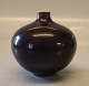 Olivin glasur 
21395 Kgl. 
Miniature Vase  
7.5 x 7.5 cm 
August 1956 
Nils Thorsson 
Royal 
Copenhagen ...