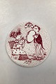 Red monthly plate in faience for September - SAISON START (Start of Season). Designed by Bjørn ...