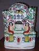Staffordshire 
figurine as 
holder for 
pocket watch