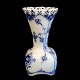 Royal 
Copenhagen,
Blue Fluted 
Full Lace 
porcelain;
A small vase 
#1161. 
First. H. 7,5 
cm. ...