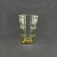Højde 16 cm.Flot vase fra 1930'erne i citrin farvet glas fra Holmegaard Glasværk.Vasen er ...