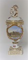 Royal 
Copenhagen. 
Porcelain egg 
vase with 
putti. Motif: 
...