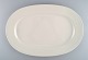 Raija 
Uosikkinen for 
Arabia. Large 
Pitsi serving 
dish with 
flower 
decoration. 
Dated ...