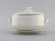 Raija 
Uosikkinen for 
Arabia. Pitsi 
lidded tureen 
with saucer 
with floral 
decoration. 
Dated ...