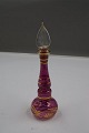 Nice and 
elegant perfume 
bottle of 
purple glass 
with gold 
decoration, as 
well as the 
original ...