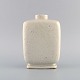 Gunnar Nylund (1904-1997) for Rörstrand. Chamotte vase in white glazed ceramics. 
1960s.
