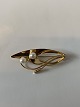 Elegant brooch 
in 14 carat 
gold
Stamped HS 585
Length 5 cm 
Nice and well 
maintained ...