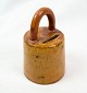 Piggy bank of 
Danish design 
in ceramic with 
a yellow glaze 
from around the 
1950s. In good 
used ...