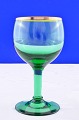 Nyhavn glas 
Holmegaard 
glasværk 
1950-1980.  
Nyhavn grøn 
hvidvinsglas 
med guldkant, 
højde 11,4 cm.