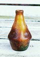 Miniature vase 
in ceramics 
from Peter 
Ipsen's Enke. 
Designed and 
glazed in 
veneer style. 
Appears ...