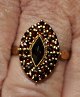 Gilt silver 
ring with 
garnets, 20th 
century.